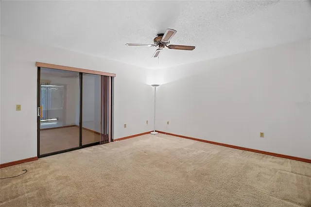 a view of room with ceiling fan