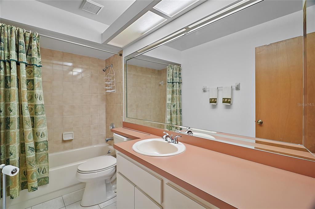 501 Cherry Tree Street Eustis, FL 32726 - Photo 23 of 35 a bathroom with a sink toilet and shower