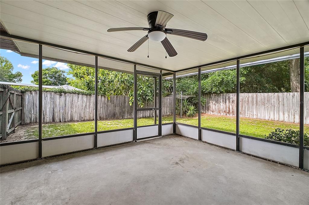 501 Cherry Tree Street Eustis, FL 32726 - Photo 25 of 35 a view of an empty room with sliding windows