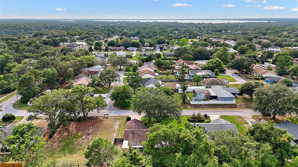 501 Cherry Tree Street Eustis, FL 32726 - Photo 33 of 35 an aerial view of a city with lots of residential buildings