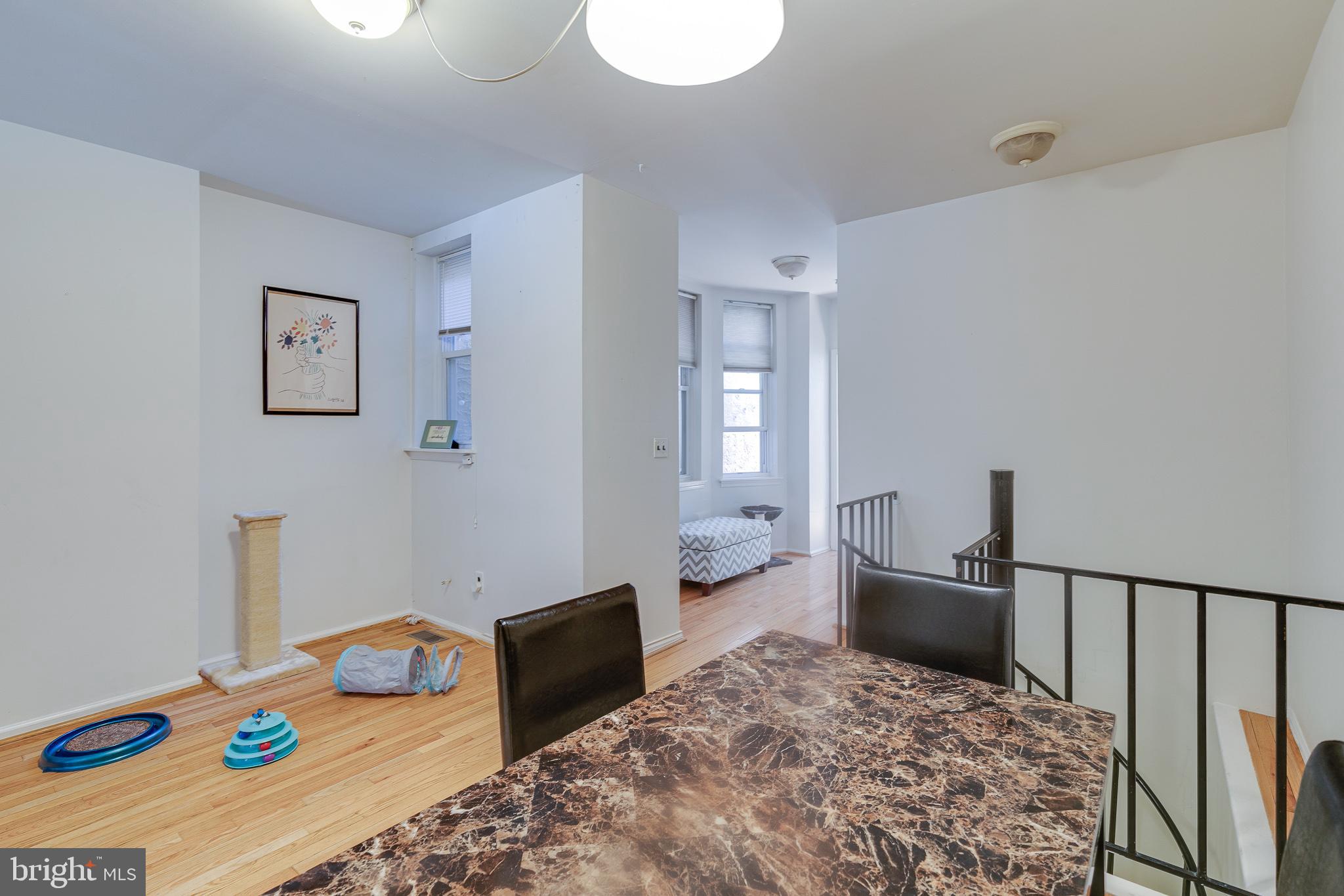 1004 Christian Street Philadelphia, PA 19147 - Photo 11 of 34 a bedroom with furniture and a wooden floor