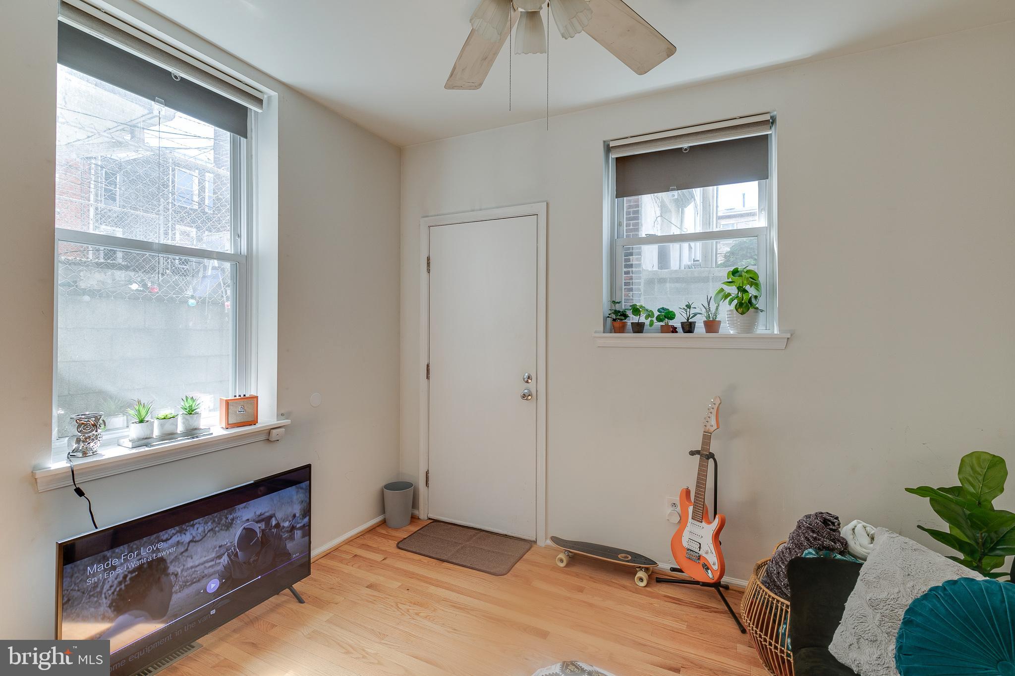 1004 Christian Street Philadelphia, PA 19147 - Photo 17 of 34 a bed room with a bed and a window
