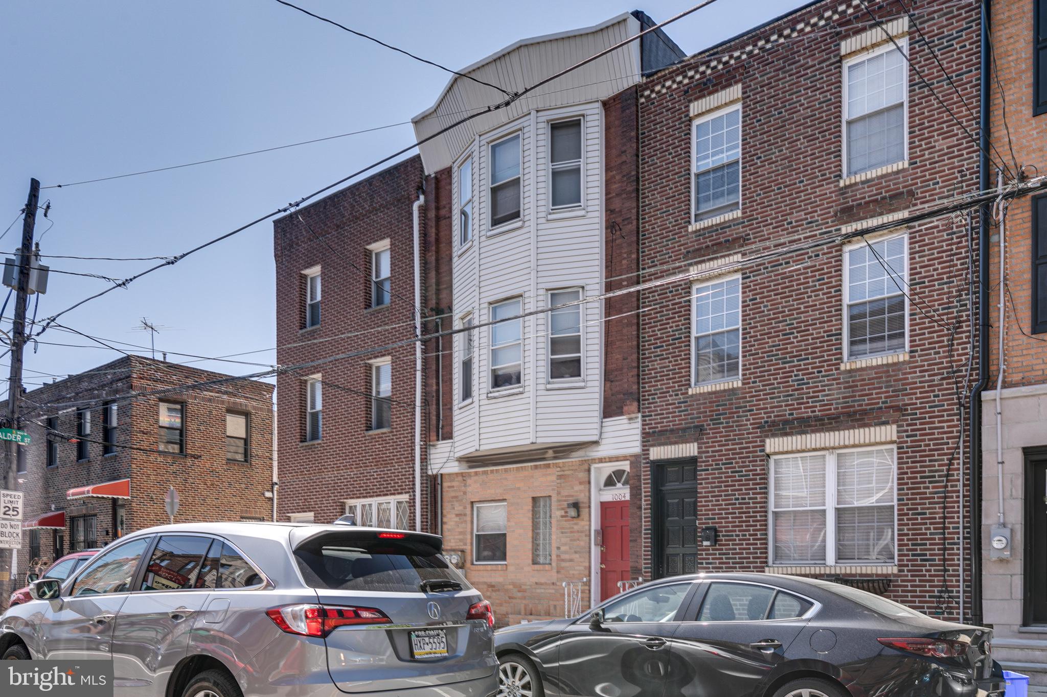 1004 Christian Street Philadelphia, PA 19147 - Photo 2 of 34 a front view of a building with cars parked