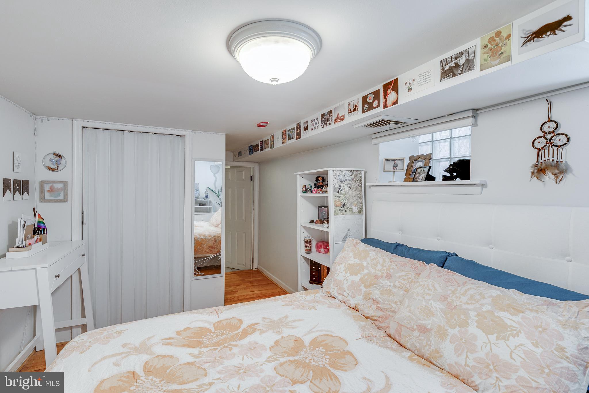 1004 Christian Street Philadelphia, PA 19147 - Photo 21 of 34 a bedroom with a bed and a large window