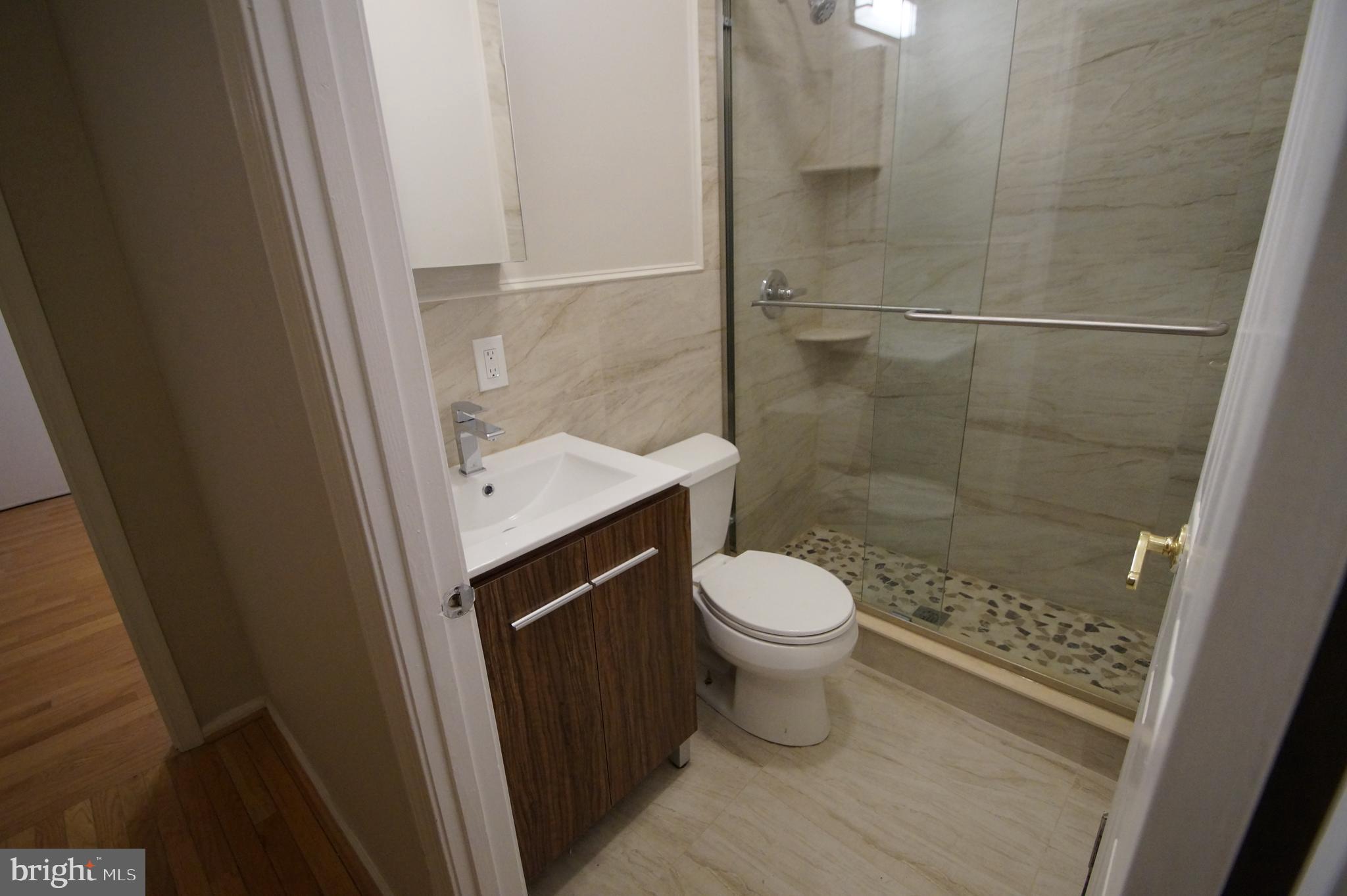 1004 Christian Street Philadelphia, PA 19147 - Photo 25 of 34 a bathroom with a toilet and a shower