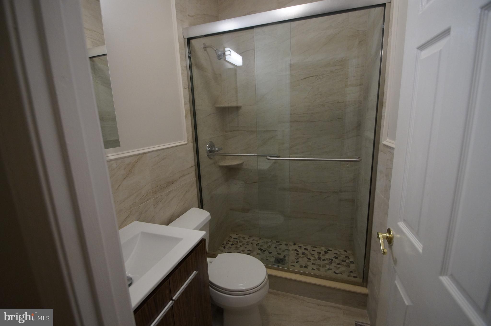 1004 Christian Street Philadelphia, PA 19147 - Photo 26 of 34 a bathroom with a shower and a toilet