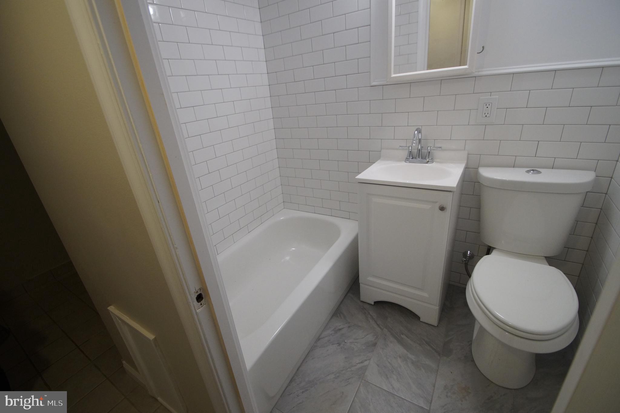 1004 Christian Street Philadelphia, PA 19147 - Photo 31 of 34 a white toilet sitting next to a white sink
