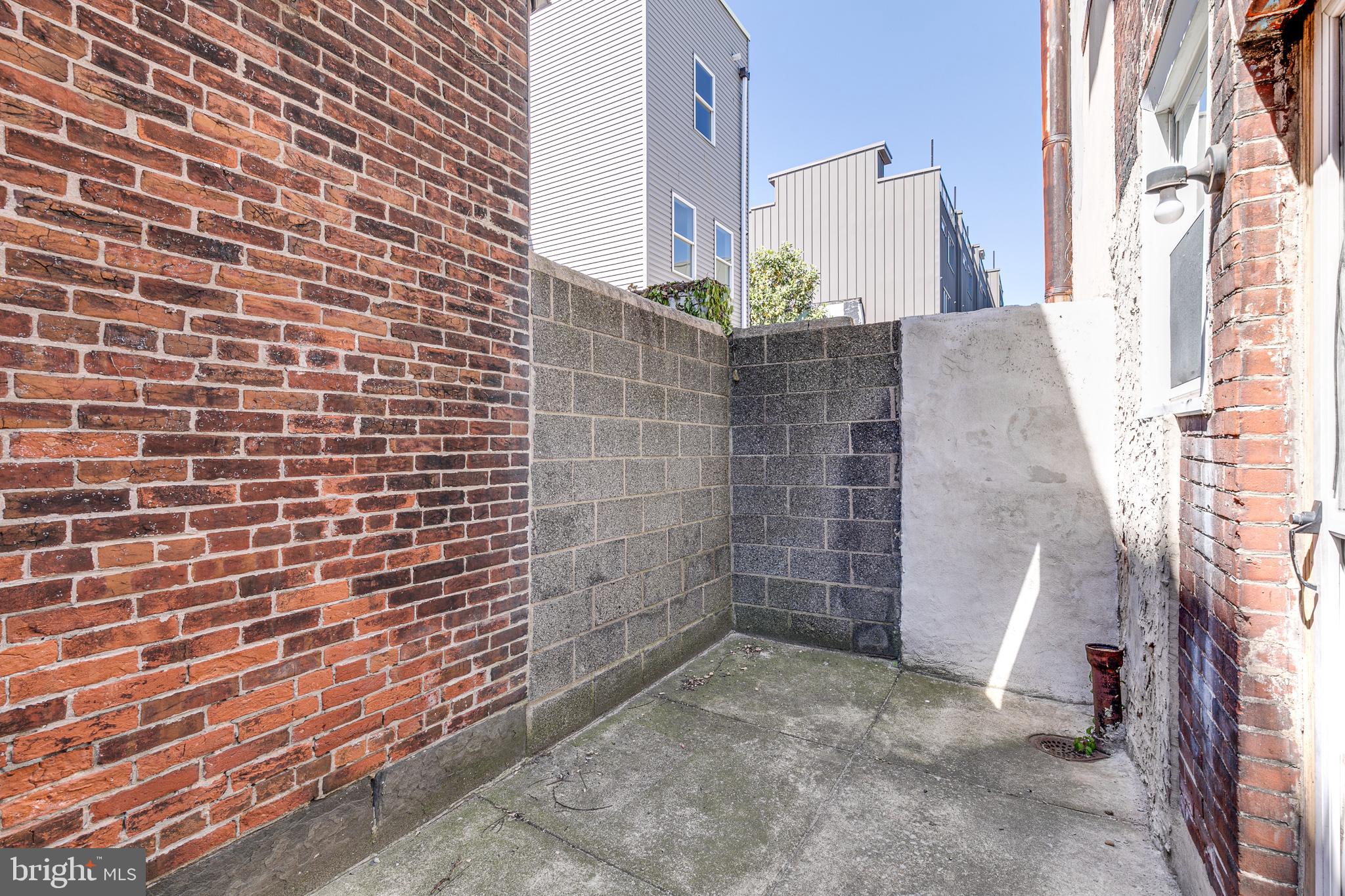 1004 Christian Street Philadelphia, PA 19147 - Photo 34 of 34 a view of a brick wall of the house