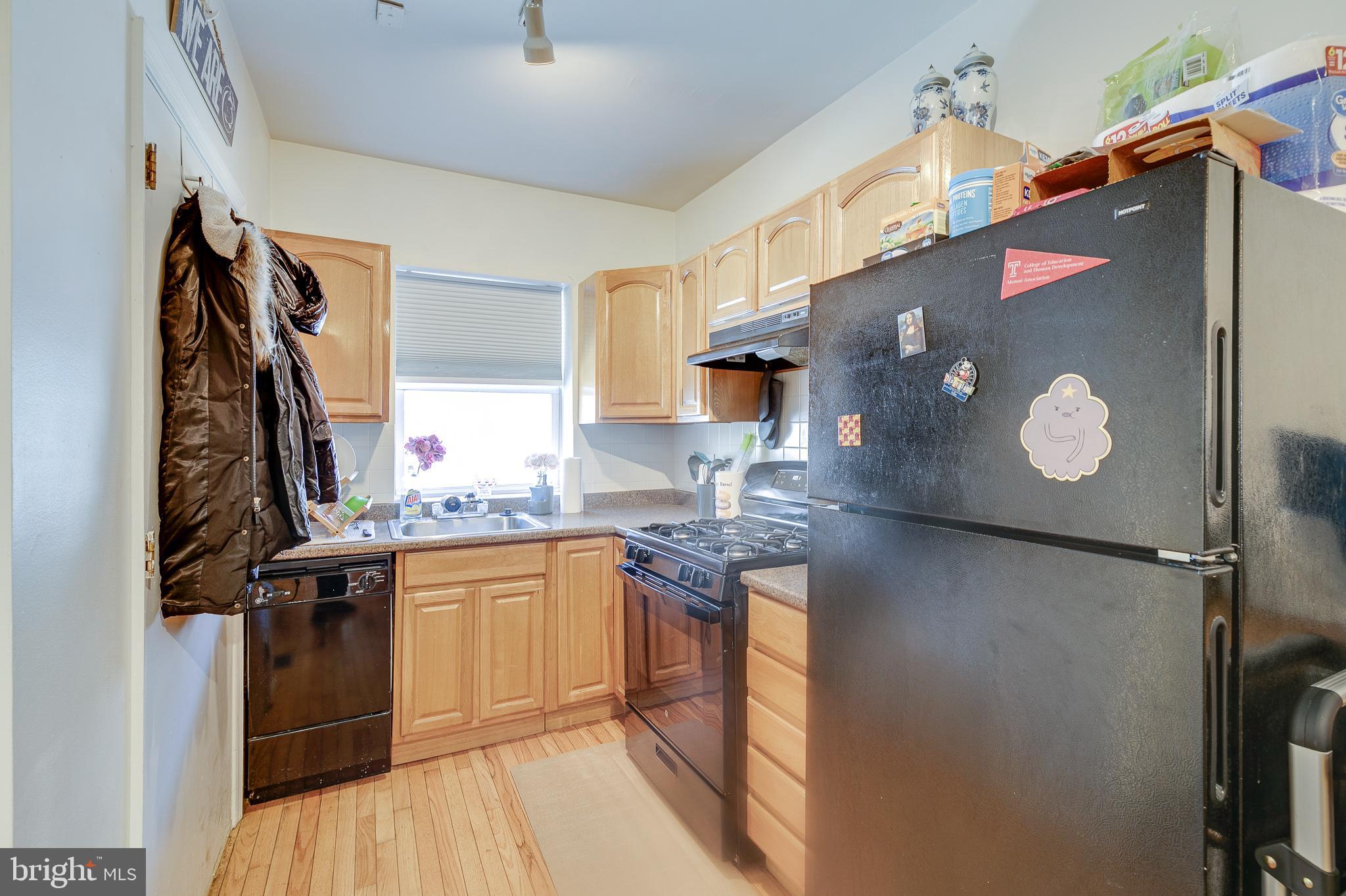 1004 Christian Street Philadelphia, PA 19147 - Photo 4 of 34 a kitchen with a sink a stove top oven and cabinetry