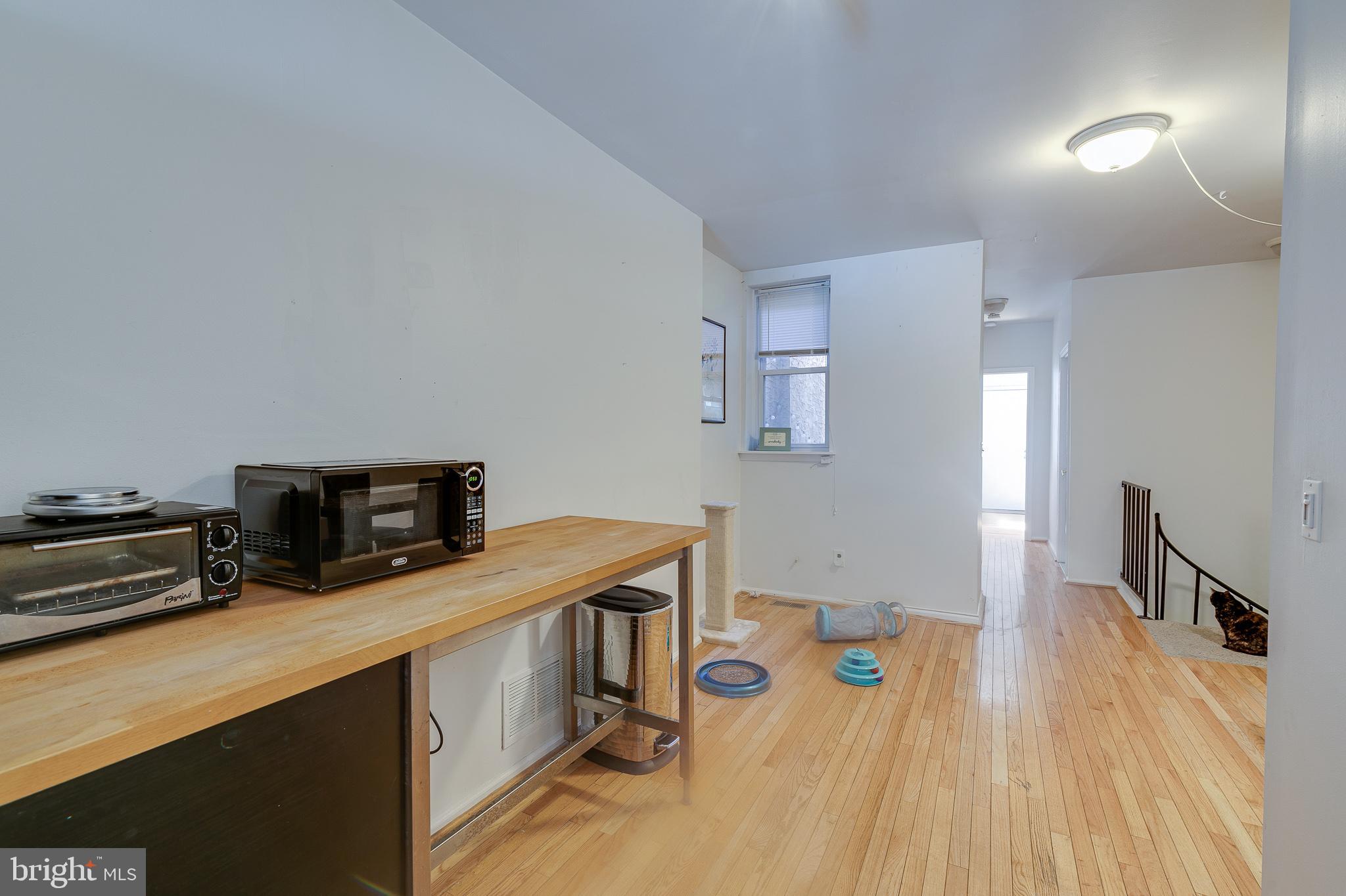 1004 Christian Street Philadelphia, PA 19147 - Photo 7 of 34 a view of a kitchen with furniture and wooden floor