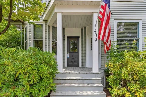 a front view of a house with a garage