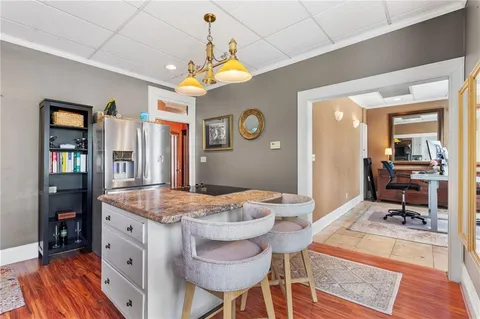 a dining room with a table and chairs