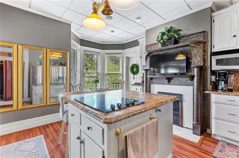 a view of living room kitchen with furniture and flat screen tv