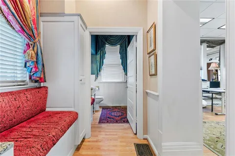 a living room with granite countertop furniture and a kitchen view