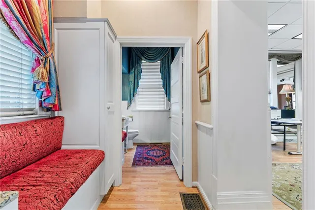 a living room with granite countertop furniture and a kitchen view