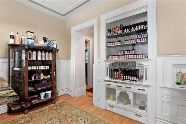 a view of a workspace with furniture and a potted plant