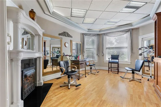 a living room with furniture a window and a fireplace