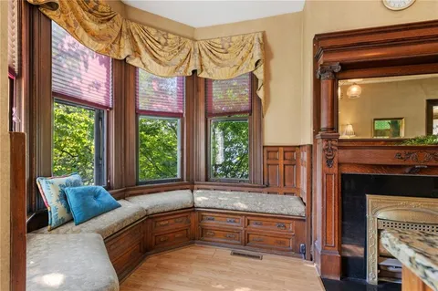 a view of a dining room with furniture window and wooden floor