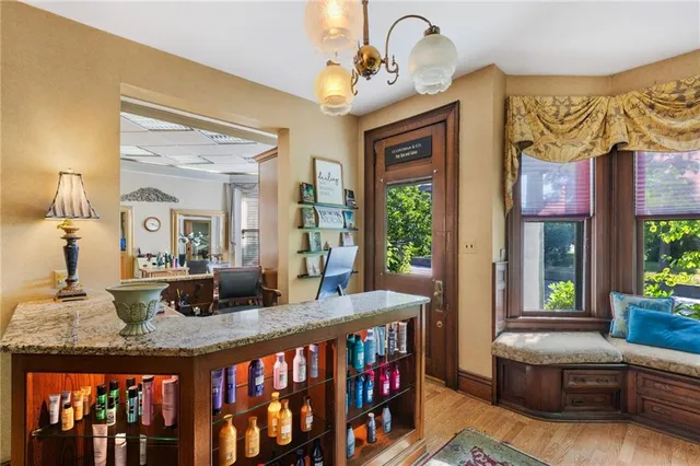 a living room with furniture a rug and a window