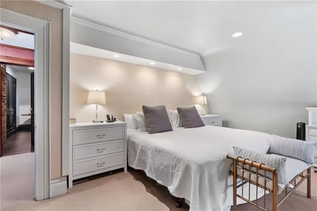 a bedroom with a bed and a cabinets