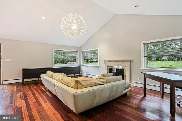 a living room with furniture and a table
