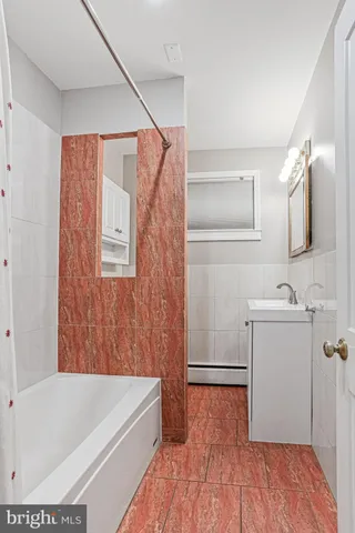 a bathroom with a sink and a bathtub