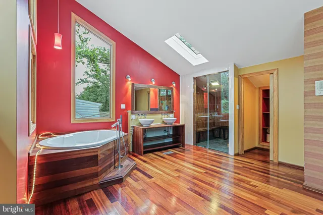 a room with a bed and a dresser