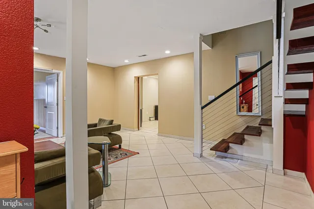 a view of entryway and hall with a living room