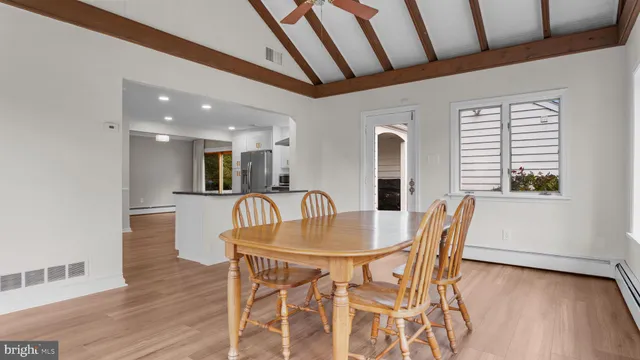 a dining room with furniture and window