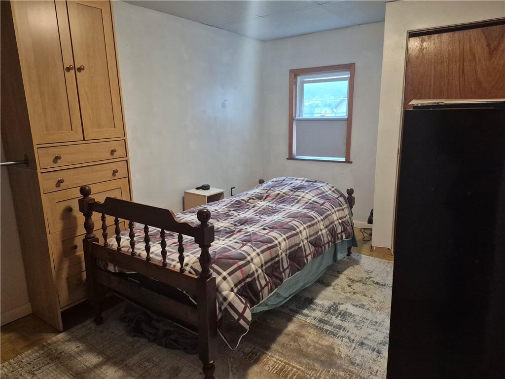 204 Ridge Avenue Derry, PA 15627 - Photo 11 of 22 a bedroom with a bed and wooden floor