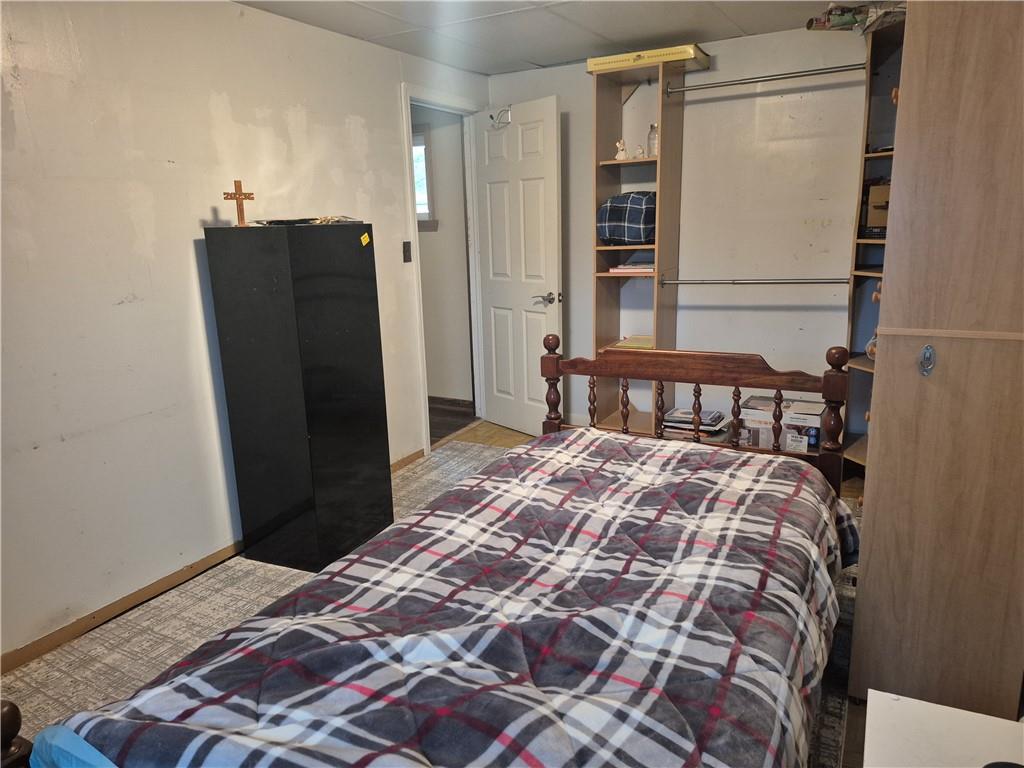 204 Ridge Avenue Derry, PA 15627 - Photo 12 of 22 a bedroom with a bed and wooden floor