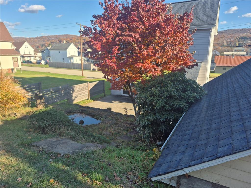 204 Ridge Avenue Derry, PA 15627 - Photo 21 of 22 a front view of a house with a yard and trees