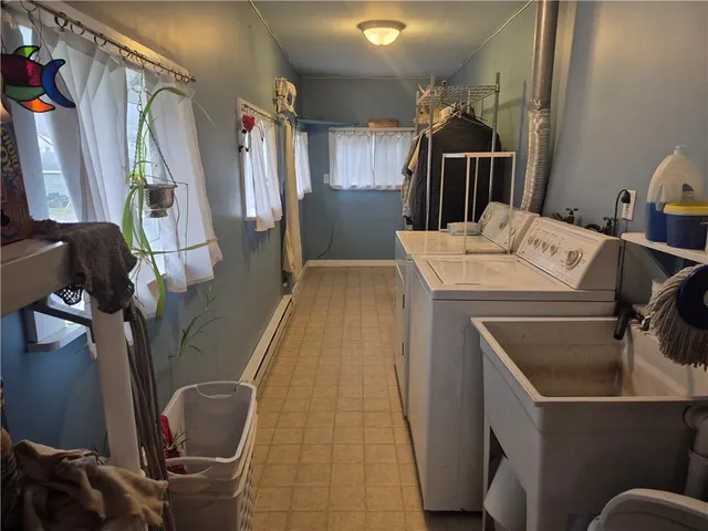 a kitchen with a stove a sink and a refrigerator