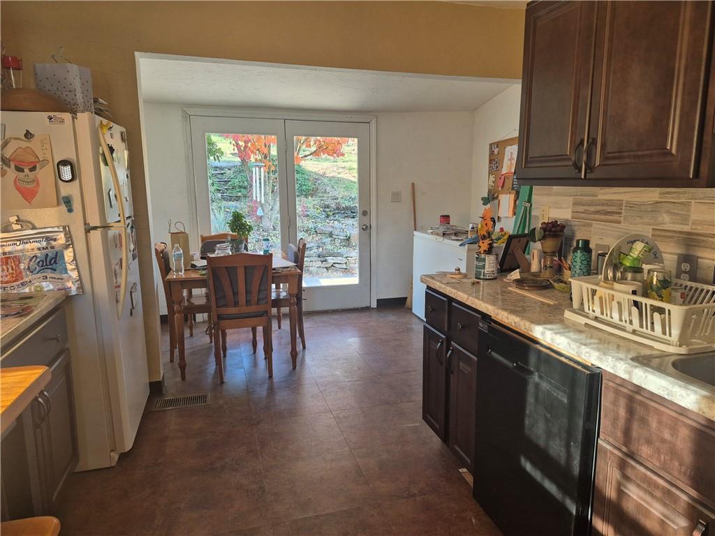 204 Ridge Avenue Derry, PA 15627 - Photo 8 of 22 a kitchen with stainless steel appliances granite countertop sink stove top oven and cabinets