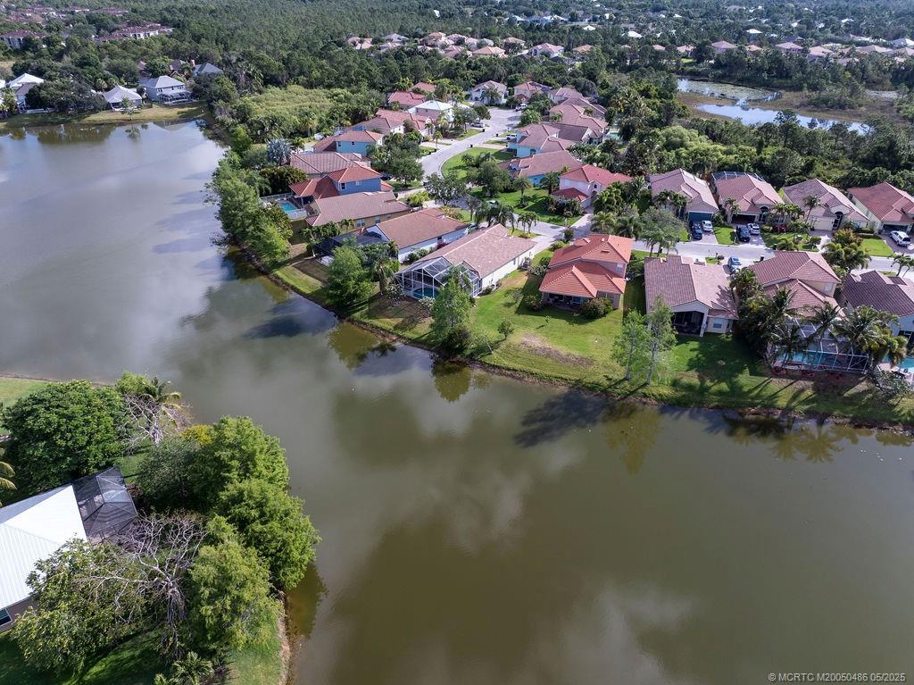 2096 Northwest Marsh Rabbit Lane Stuart, FL 34994 - Photo 13 of 58 an aerial view of lake residential houses with outdoor space and lake view