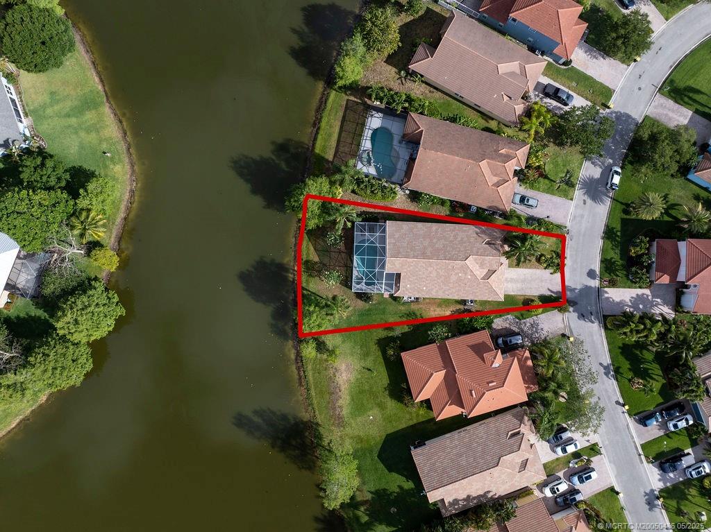 2096 Northwest Marsh Rabbit Lane Stuart, FL 34994 - Photo 15 of 58 an aerial view of a house with a yard