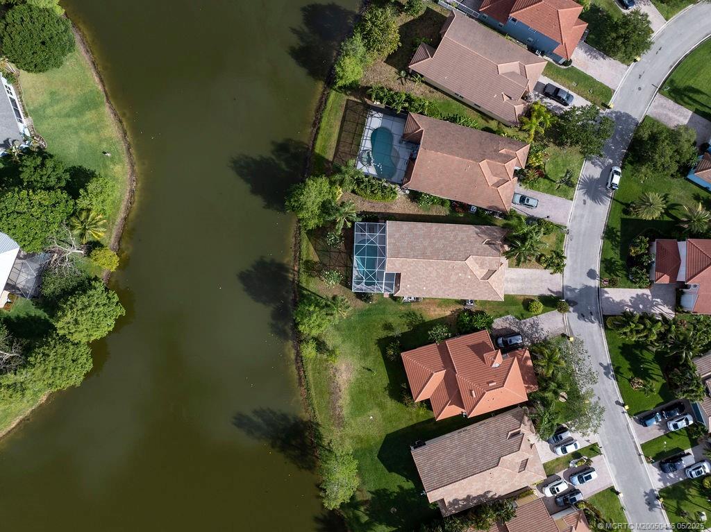 2096 Northwest Marsh Rabbit Lane Stuart, FL 34994 - Photo 16 of 58 an aerial view of a house with a yard
