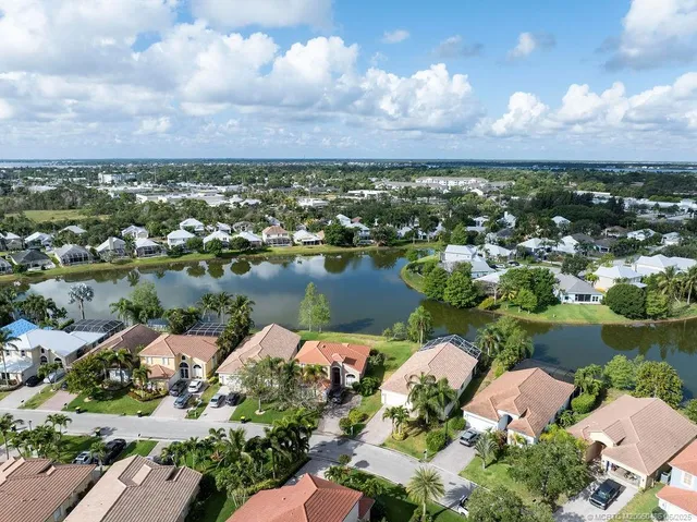 an aerial view of lake residential house with outdoor space and garden
