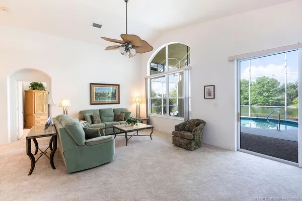 a dining room with furniture and window
