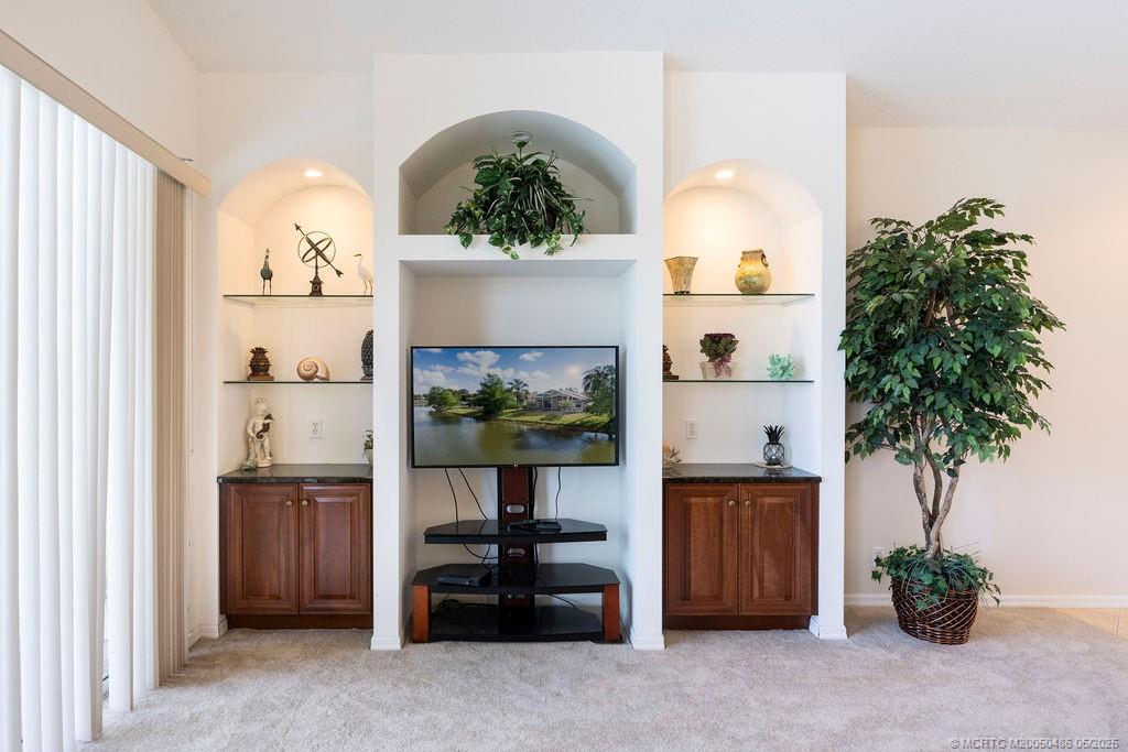 2096 Northwest Marsh Rabbit Lane Stuart, FL 34994 - Photo 33 of 58 a room with furniture and a potted plant