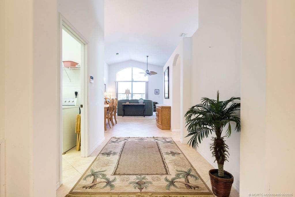 2096 Northwest Marsh Rabbit Lane Stuart, FL 34994 - Photo 53 of 58 a living room with furniture and a potted plant