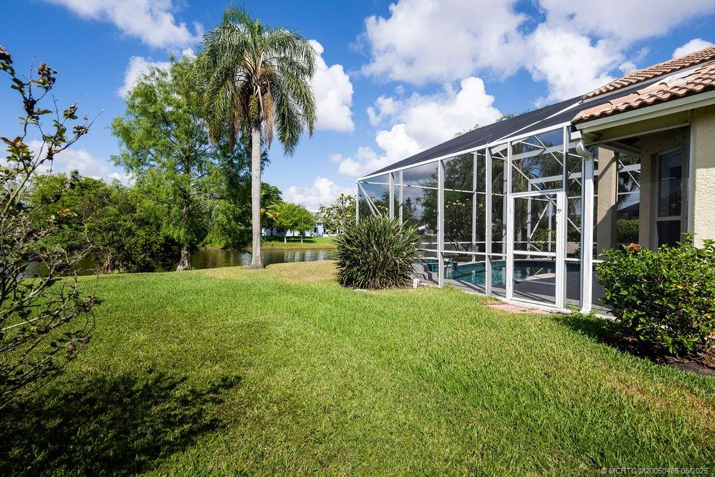 2096 Northwest Marsh Rabbit Lane Stuart, FL 34994 - Photo 55 of 58 a view of a house with backyard and garden