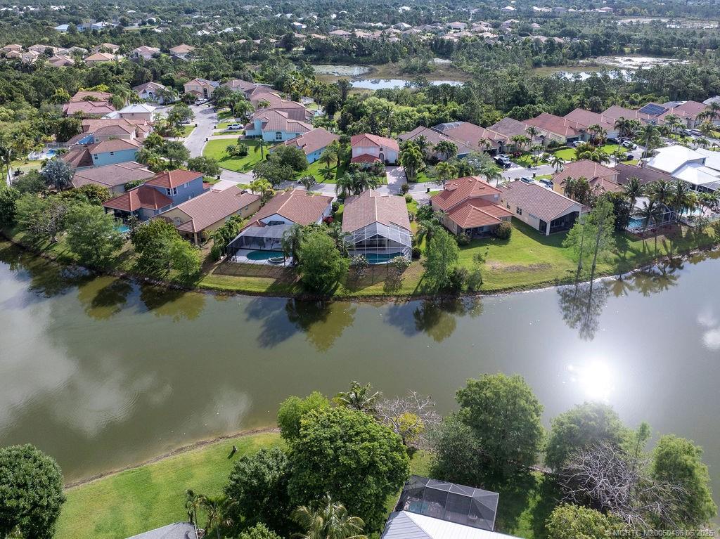 2096 Northwest Marsh Rabbit Lane Stuart, FL 34994 - Photo 7 of 58 an aerial view of residential houses with outdoor space and lake view
