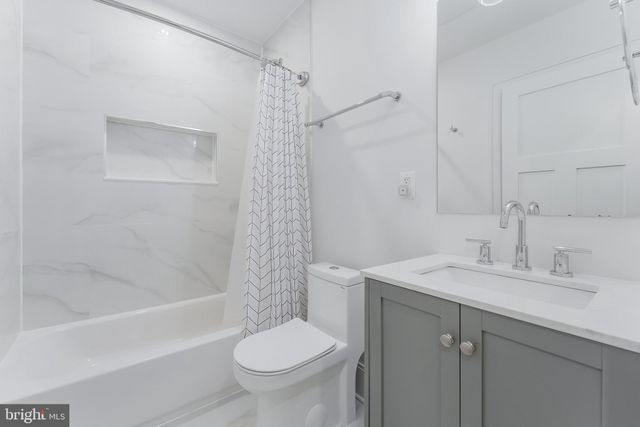 a view of a hallway with washer and dryer