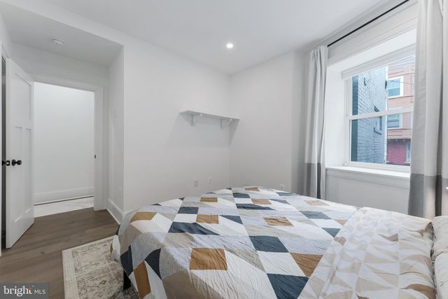 a view of living room with furniture and window