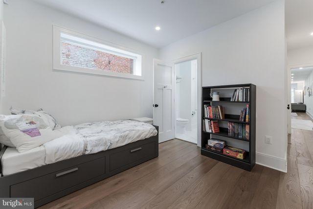 a bedroom with a workspace