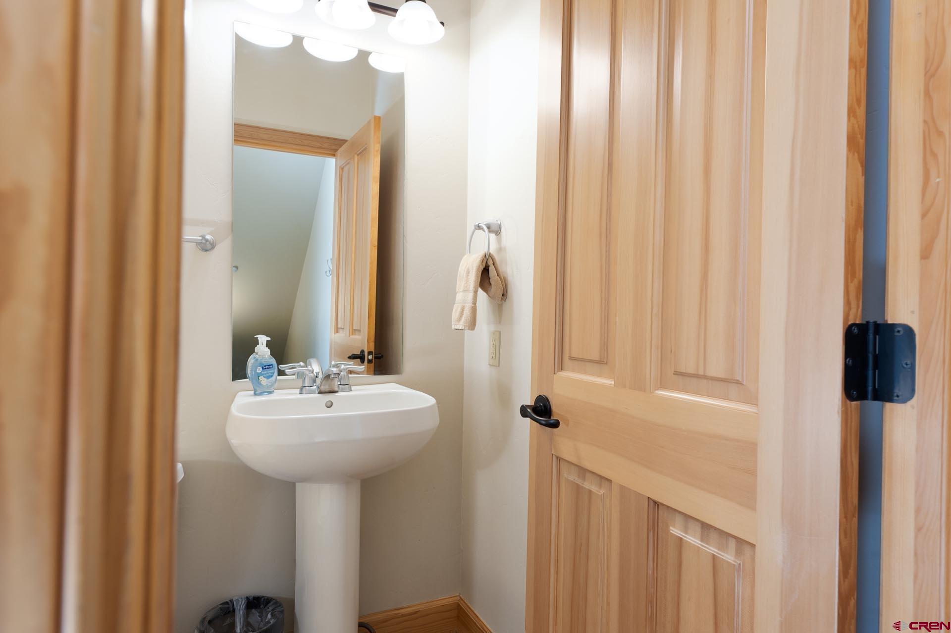1422 Animas View Drive, Unit 55 Durango, CO 81301 - Photo 12 of 44 a bathroom with a sink a mirror and a shower