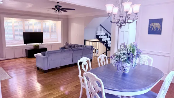 a living room with furniture or chandelier and a flat screen tv