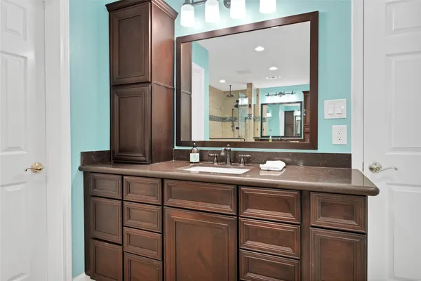 a bathroom with a sink and a mirror