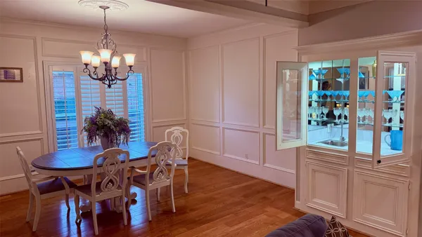 a bathroom with a mirror sink and bathtub